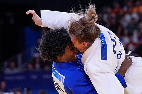 Michaela Polleres and Marie Eve Gahie compete during women -70 kg judo competition